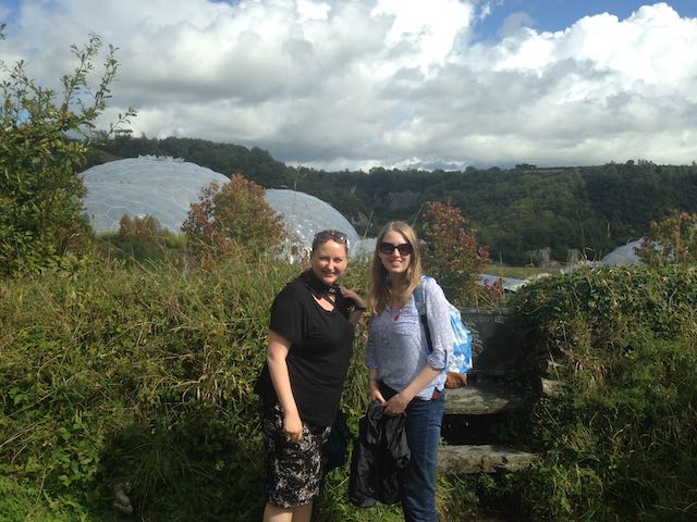 two women by the eden project biomes in the day