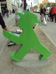 a plastic green statue of a man